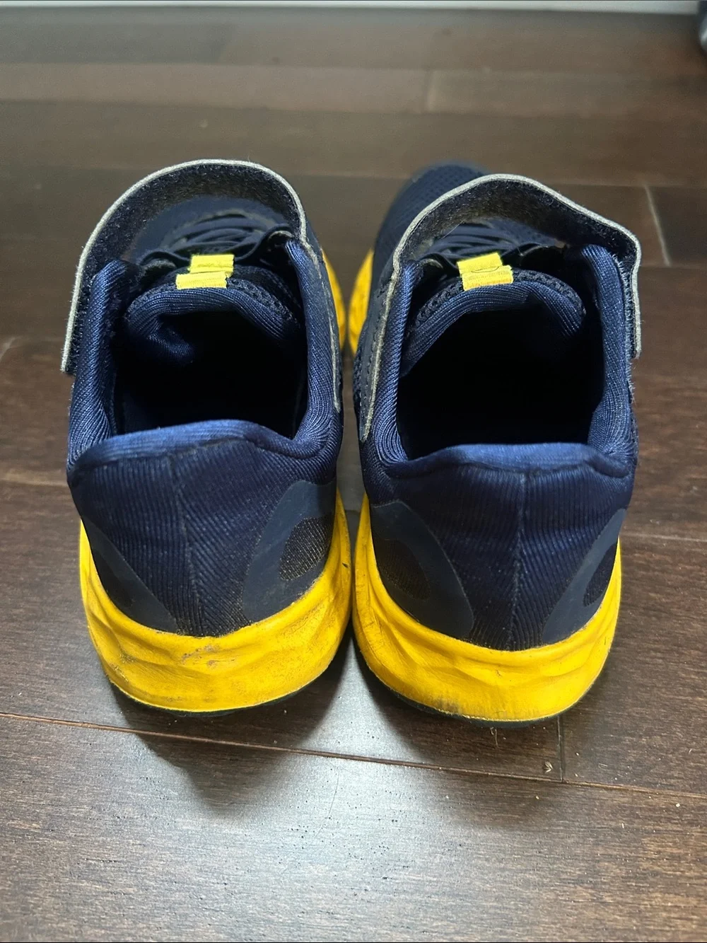 New Balance Kids Navy Sneakers with Yellow & Red Accents
